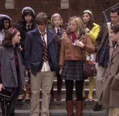 a group of young people standing on the steps