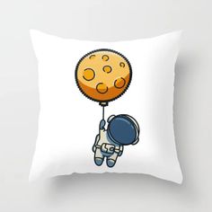 a pillow that has an image of a cookie on it with a balloon attached to it