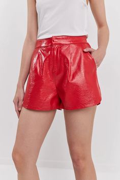 Introducing our stylish High-Waisted Faux Leather Shorts. The high waist design with an elastic waistband in the back and a soft, lined interior provides a figure-flattering fit that looks great. Our shorts are crafted from a shiny faux leather fabric, for a sleek and contemporary look. So, if you're looking for a stylish and versatile piece perfect for any season, look no further! Faux Leather Shorts, Romper And Jacket, Jumpsuit Jacket, Faux Leather Fabric, Leather Shorts, Cami Tanks, Scarf Hairstyles, Leather Fabric, Orange And Purple