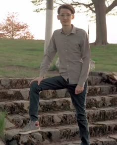 a man sitting on top of some steps