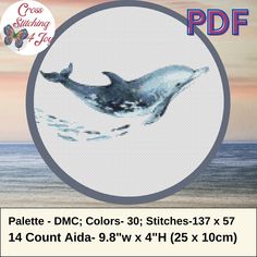 the cross stitch pattern shows a whale jumping out of the water