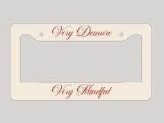 a white license plate with red lettering that says, hey demne very mindful