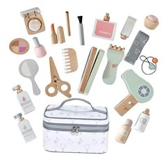 the contents of a travel bag are arranged in a circle with scissors, combs, and other items