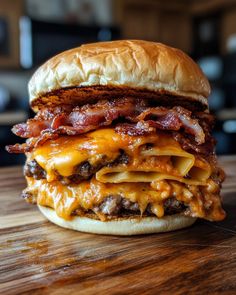 a bacon cheeseburger on a wooden table