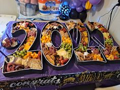 a purple table topped with lots of food