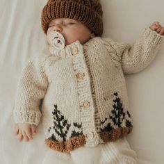 This sweater is styled with cable trim raglan sleeves and wood buttons. Hand-knit, in natural colored yarn, it is cozy and warm. There is also a matching Forest knit hat if you want to match this up. What a wonderful gift for any little person you know. 100% Acrylic Cold handwash