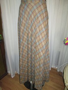 60's ladies ankle length plaid/pleated wool skirt by Kelita of New York, in a size 7.  Skirt colors are in several browns, teal blue, gold, pink, orange, side nylon zipper, with button waistband closure , lots of skirt flare, and is in great condition.  Waist is 26", Length 44". PRICE IS $49.00SALE FINAL/AS IS/NO RETURNS. Aline Midi Skirt, Historical Outfits, Donna Mills, Brown Teal, Plaid Pleated Skirt, Patchwork Skirt, Floor Length Skirt, Skirt Fits, Wool Skirt