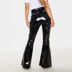 Product Description:Latex Leather High Waisted Flare Trouser Plus SizeWomen Stretch Slim PVC Pants Leggings Office Lady PU Leather TrousersFeatures:Go for a bold Halloween outfit with these vinyl flares. Featuring a bold red vinyl fabric. an elasticated waistband and a flared leg fit. team it with the matching crop top and devilish accessories to finish off the look.Size Chart:Model ShowSPECIFICATIONS:Waist Type: HIGHStyle: Office LadySize: XS.S.M.L.XL.XXL.3XL.4XLSeason: SummerPattern Type: Soli Vinyl Straight Leg Pants, Black Pvc Pants, Latex Bell Bottom Pants, Bell Bottoms Leather Pants, Latex Flare Pants, Luxury Chic Flared Leather Pants, Vinyl Black Pants, Luxury Fitted Shiny Pants, Latex Wide Leg Pants