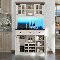 a kitchen with white cabinets and blue counter tops