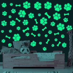 glow in the dark dog paw and bones wall decals with green glow on it