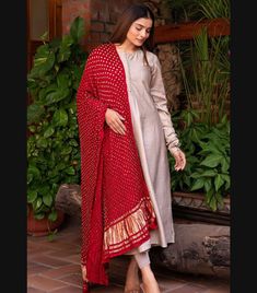 Item details:- Handmade 👉Lift your style with this timeless salwar kameez set from TarzIndianLehenga. 👉Crafted from SILK FABRIC, it's designed with a boat neck with Red Bandhani  Dupatta and long sleeves. 👉The dress is paired with a STRAIGHT PANTS in the same hue .Finish the the look with some ELEGANT statement jewelry. 🌸Product Specifications:- KURTI-- Fabric:- Silk Length:- 45 Inner:- Cotton Style:- A-line Neck:- Boat neck BOTTOM:- Fabric:- Silk Inner:- Cotton Length:- Upto 40" Closure:- E Maroon Dupatta Combination, Transitional Anarkali Set In Jamawar, Transitional Slub Silk Salwar Kameez With Dupatta, Unstitched Anarkali Set With Dupatta, Diwali Jamawar Anarkali Set, Churidar With Sheer Dupatta And Traditional Drape In Mulmul, Churidar With Sheer Dupatta In Traditional Drape, Anarkali Style Jamawar Churidar, Traditional Mulmul Churidar With Sheer Dupatta