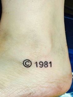 a small tattoo on the foot of a person