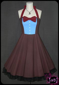 a dress with a bow on the neckline and a collared shirt underneath it