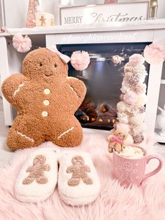 there is a teddy bear and slippers on the floor next to a fire place