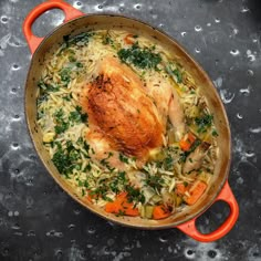 a large pot filled with chicken and vegetables