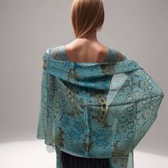 "Fractal beauty on silk chiffon in subtle shades of light blue and gold! This lovely, long shawl/scarf recalls the complexity of Islamic art, but the pattern is actually a multi-layered fractal design. Length is 78 inches, long enough to knot and wrap almost any way you wish. The silk chiffon used for this scarf  is a very tight weave: amazingly smooth and luxurious to the touch, feels lovely to wear. * Digitally printed original design * 100% silk chiffon. * Approx. 78\" x 24\". * Machine hemmed * Dry clean only * Ironing is fine, press cloth recommended to prevent staining * Arrives packed in an elegant gift-box" Traditional Blue Silk Shawl Scarf, Traditional Blue Silk Shawl, Blue Silk Shawl Dupatta, Traditional Blue Silk Scarf, Traditional Blue Silk Scarves, Elegant Blue Shawl With Dupatta, Silk Shawl With Sheer Dupatta, Turquoise Silk Dupatta, Silk Sheer Dupatta Shawl