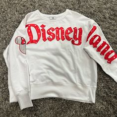 New With Tags Womens Disneyland White Crew Neck Size L With Red Lettering Across The Chest And Down The Sleeve With Minnie Mouse Head On The Other Sleeve Disneyland Crewneck, Disney Crewneck Sweatshirt, Nightmare Before Christmas Sweater, Minnie Mouse Head, Minnie Mouse Sweater, Light Knit Sweater, Jersey Sweater, Crewneck Sweatshirt Women, Green Crewneck