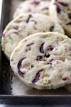 several cookies are sitting in a metal pan