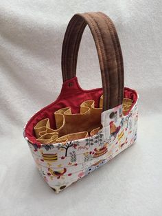 Collect your backyard fresh eggs with this handmade Egg Gathering Quilted Tote to safely carry your fresh gathered eggs back home in style. These cute and sturdy totes are made from cotton fabric and Soft n Stable foam stabilizer-which helps to holds its shape.  The handle makes it easy to carry and has a snap to help secure the eggs in place. Inside are 10 attached pockets to hold eggs with room in the center to hold a couple more for a dozen fresh gathered eggs. Turn handle under tote to easil Egg Handling Instructions, Tote With Pockets, Quilting Room, Quilted Totes, Fresh Eggs, Cotton Fabric, Turn Ons, Pet