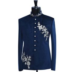 a man's blue jacket with white flowers on the chest and buttons down the front