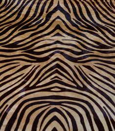 an animal print pattern is shown on the surface of a bed sheet that has been made to look like zebra stripes