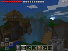 an image of a minecraft house in the middle of a mountain side area with trees, rocks and water