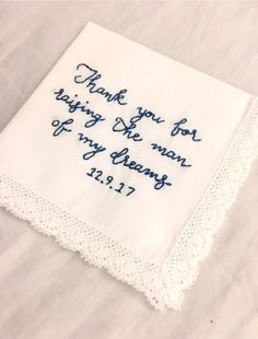 a white hanker with blue writing on it that says thank you for raising the man of my dreams