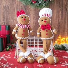 two gingerbread man and woman standing next to each other