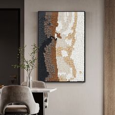 a dining room table with chairs and a painting on the wall above it that looks like mosaic tiles