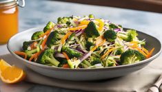 a salad with broccoli, carrots and shredded cheese in a white bowl