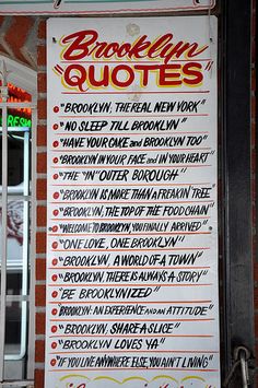 a sign on the side of a building that says brooklyn quotes written in different languages