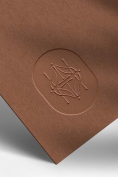 a brown paper with an image of a cross on it and the word's symbol is