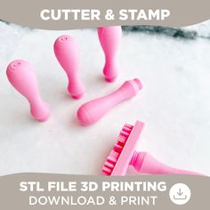 three pink toothbrushes sitting next to each other on top of snow covered ground