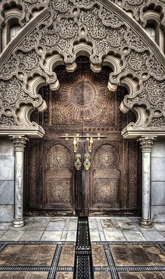 the entrance to an ornately decorated building