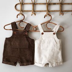 Cordie Shortie Corduroy Overalls Our 100% cotton corduroy overalls are both practical and stylish. Brimming with vintage charm they are a perfect transitional piece. They feature a generous front pocket (perfect for storing precious treasures!) and wooden buttons with adjustable button holes. They also feature folded and sewn leg cuffs. Measurements: Chest (underarm to underarm): 6-12M 27cm, 1-2 29cm, 2-3 31cm, 3-4 33cm, 4-5 35cm Length (shoulder to hem from 1st/2nd button): 6-12M 42/45cm, 1-2 4 Short Overalls, Corduroy Overalls, Leg Cuffs, Handmade Dresses, Clothing Co, Dungarees, Quilted Jacket, Short Girls