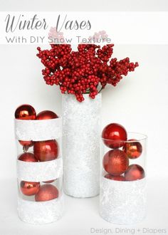 there are three vases with red ornaments in them and one is filled with balls