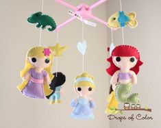 three little princesses hanging from the ceiling in a nursery or kids's room