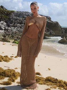 The MAGEN knitted fishnet style top is the perfect beach cover-up! This ultra-cropped top features long sleeves, a wide neck, and an open scooped back. The MAGEN knitted maxi skirt is the perfect beach cover-up! Sitting low on the hips this sexy fishnet style skirt will shine over your BANANHOT bikini, tied with a bow.
 Select: Top, Bottom; Size: XS/S, M/L Knitted Maxi Skirt, Fishnet Style, Knit Swimwear, Skirt Coverup, Knit Maxi Skirt, Boys Swimwear, Mesh Skirt, Swim Skirt, Style Skirt