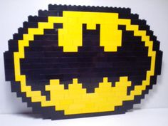 a black and yellow smiley face made out of legos