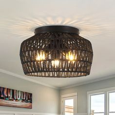 a basket light fixture in a bedroom with white walls