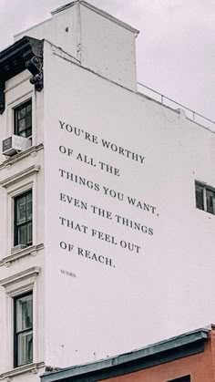 an advertisement on the side of a building that says you're worthy of all the things you want even the things that feel out of reach