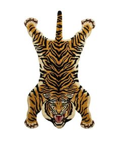 an animal rug with a tiger on it's back and one paw raised in the air