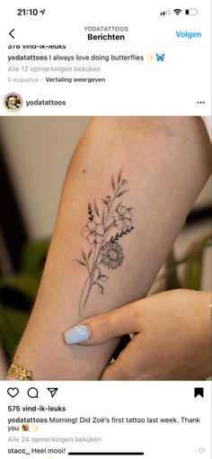 a woman with a flower tattoo on her arm