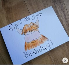 a birthday card with an image of a highland cow