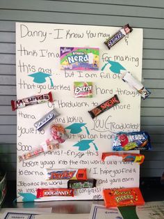 a bulletin board with candy bars on it