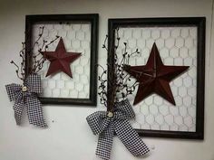 two red stars are hung on the wall next to each other with gingham bows