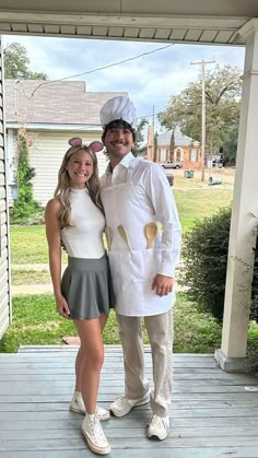 a man and woman are dressed up in costumes