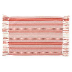 an orange and white striped rug with fringes on the bottom, in front of a white background