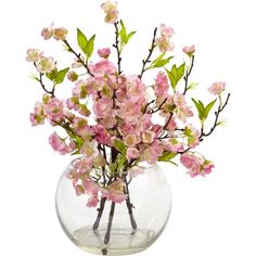 a vase filled with pink flowers on top of a table