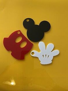 mickey mouse ears and mask cutouts on the side of a yellow car with red nose